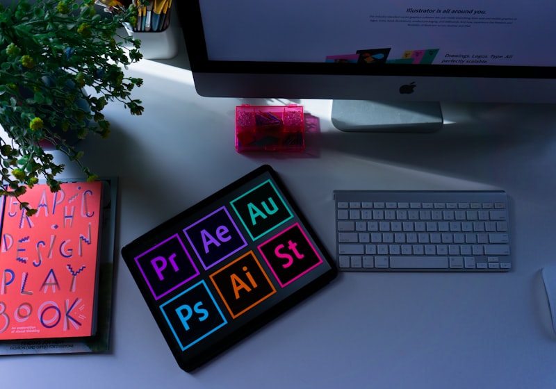 Creative design software open on screen, showing a suite of professional applications.