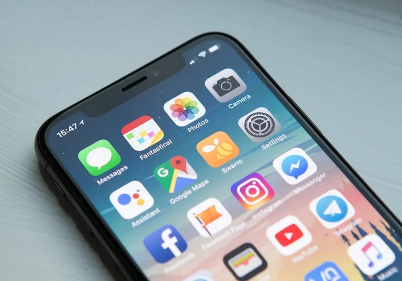 A smartphone displaying a home screen of polished application icons.